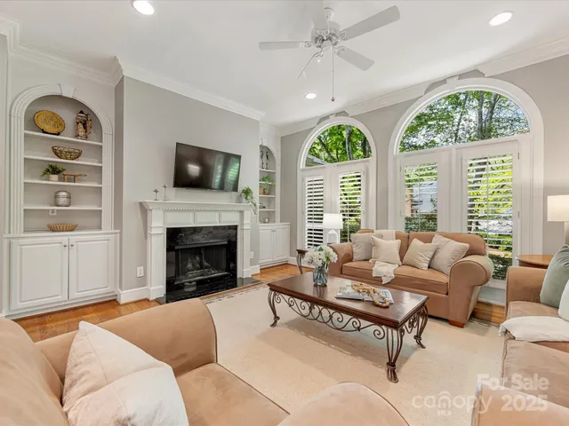 a kitchen with granite countertop a refrigerator stove top oven and sink