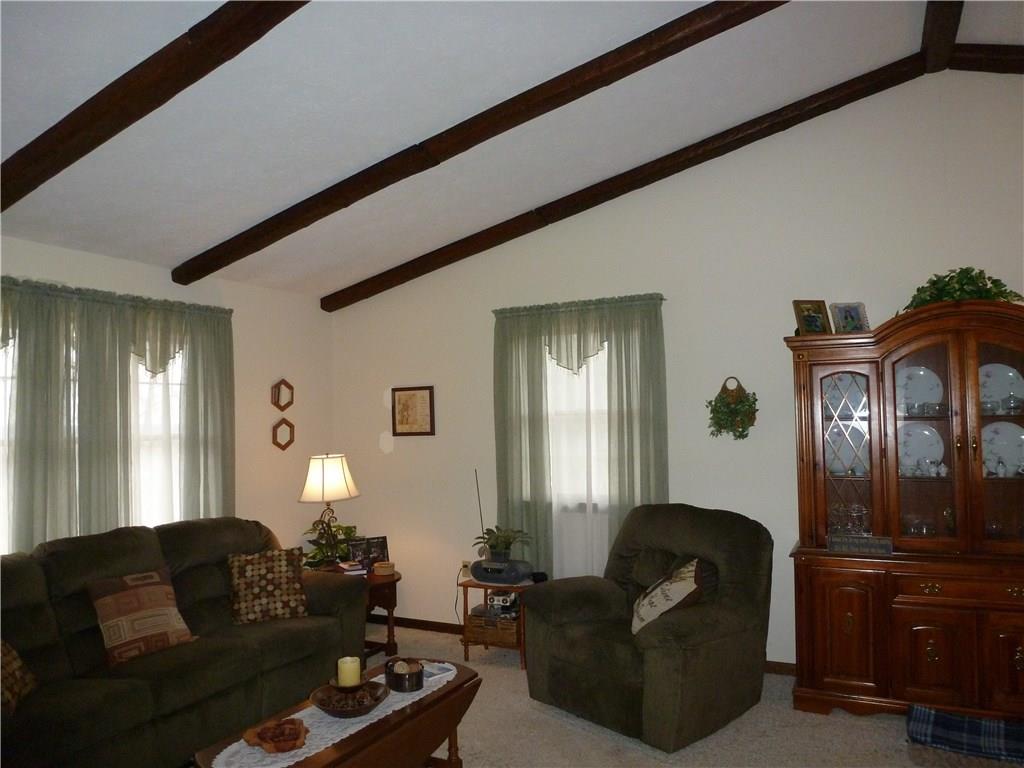 514 Simpson Church Road Kittanning, PA 16201 - Photo 7 of 25 Open concept large Living Room and Dining Room with vaulted ceilings and faux beams