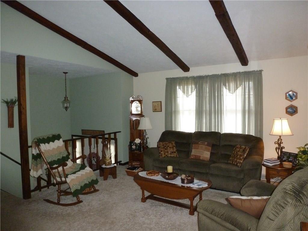 514 Simpson Church Road Kittanning, PA 16201 - Photo 8 of 25 Open concept large Living Room with vaulted ceilings and faux beams steps down to main house entrance