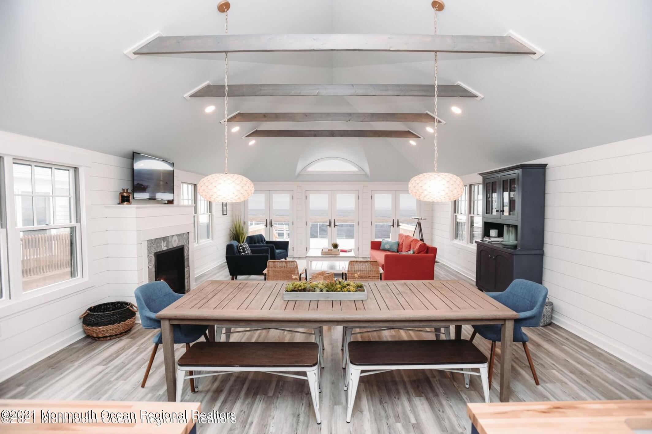 117 Boardwalk Point Pleasant Beach, NJ 08742 - Photo 2 of 24 a view of a dining room with furniture and wooden floor