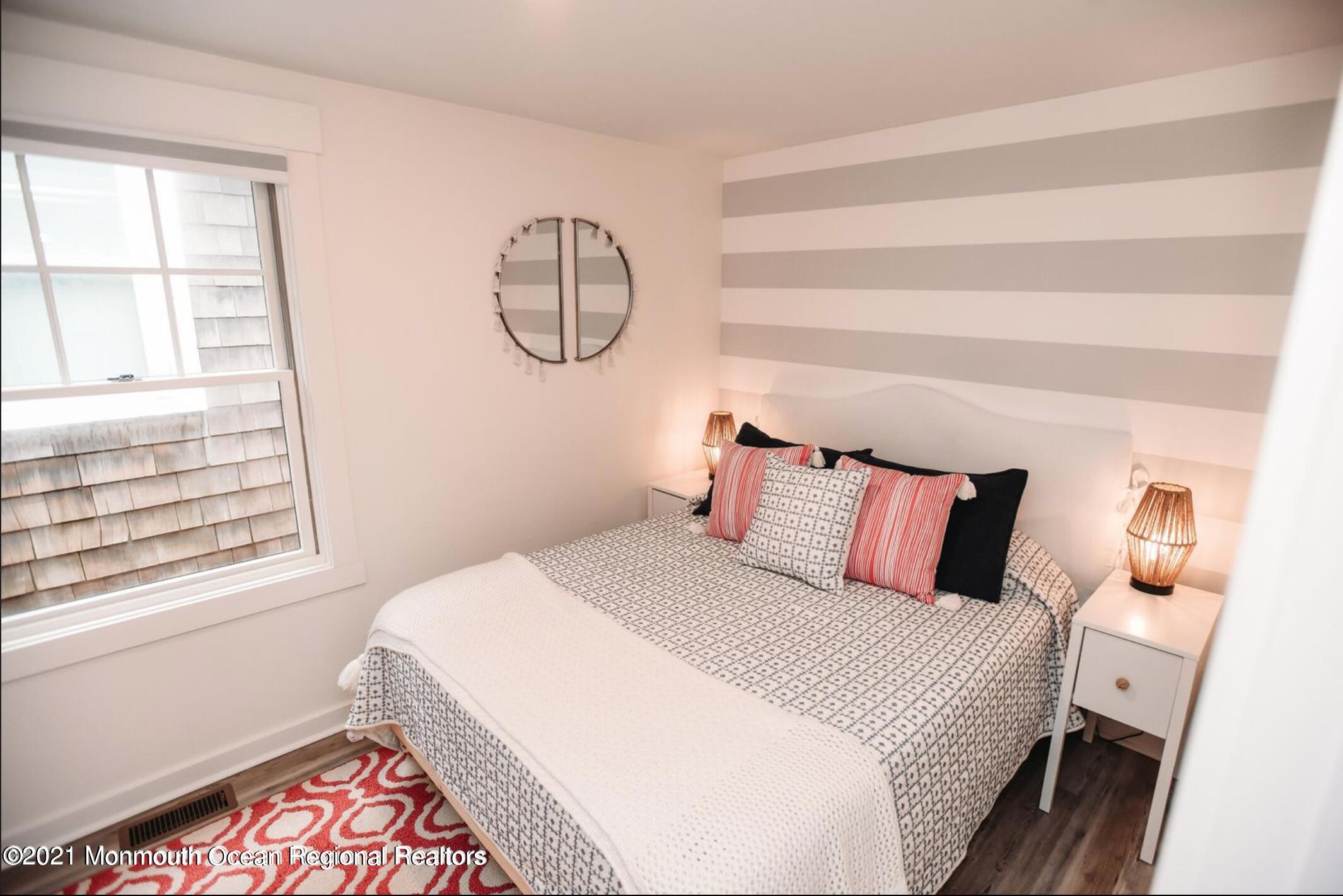 117 Boardwalk Point Pleasant Beach, NJ 08742 - Photo 11 of 24 a bedroom with a large bed and a window