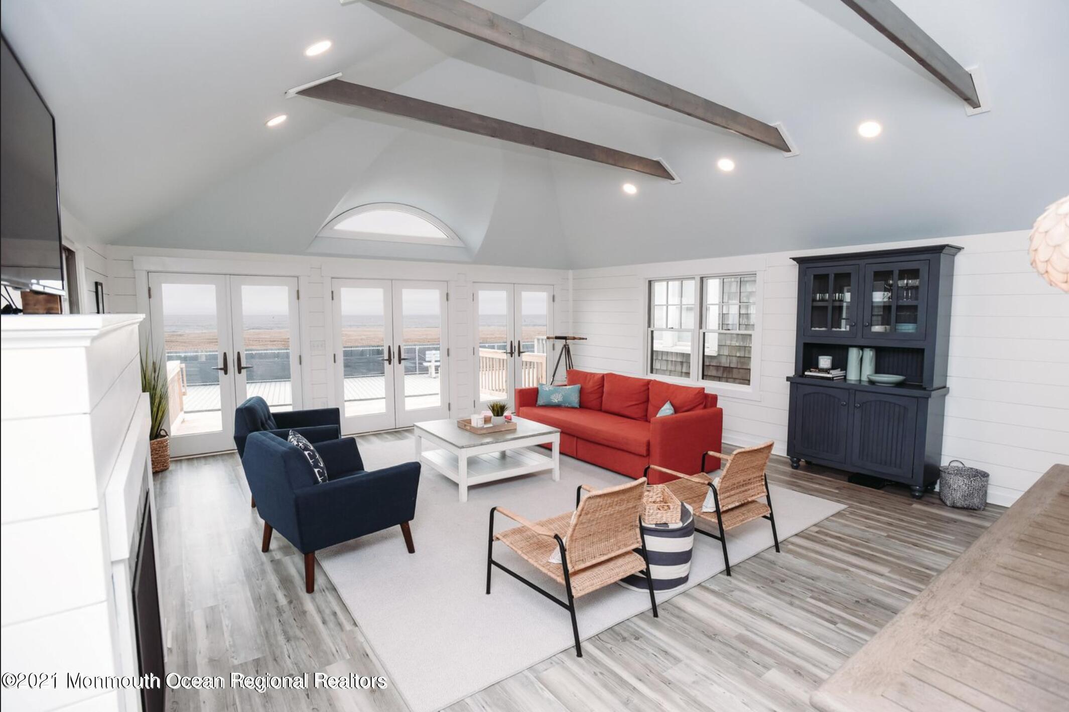 117 Boardwalk Point Pleasant Beach, NJ 08742 - Photo 3 of 24 a living room with furniture and a wooden floor