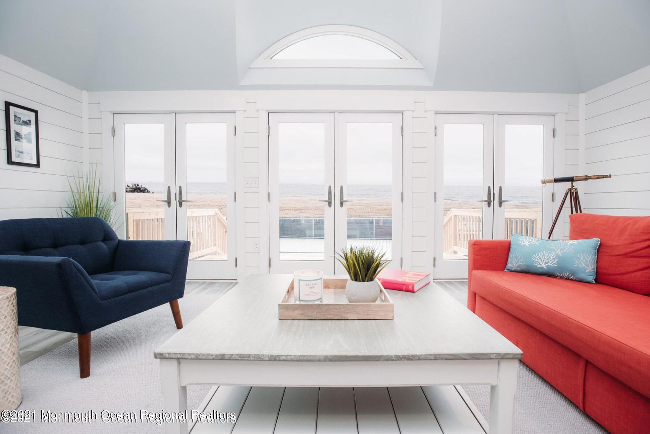 117 Boardwalk Point Pleasant Beach, NJ 08742 - Photo 4 of 24 a living room with furniture and a large window