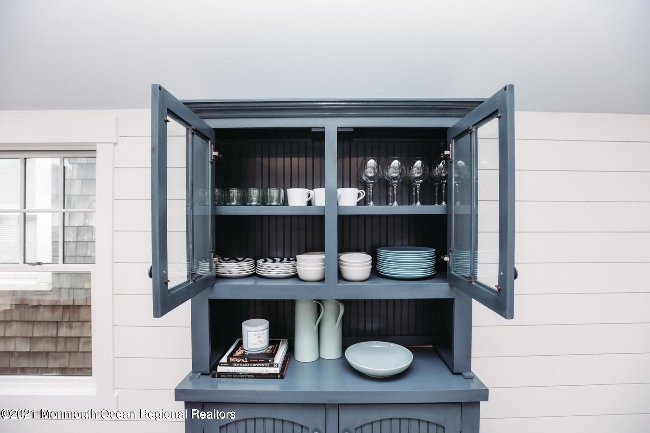 117 Boardwalk Point Pleasant Beach, NJ 08742 - Photo 8 of 24 a kitchen with a sink and wooden cabinets