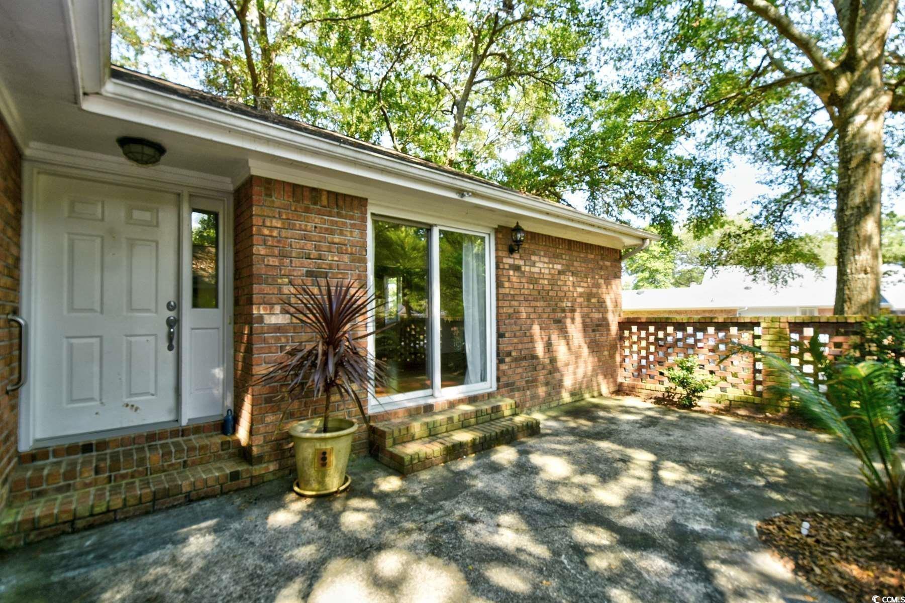 816 Kittiwake Lane Murrells Inlet, SC 29576 - Photo 3 of 25 Exterior space featuring brick siding