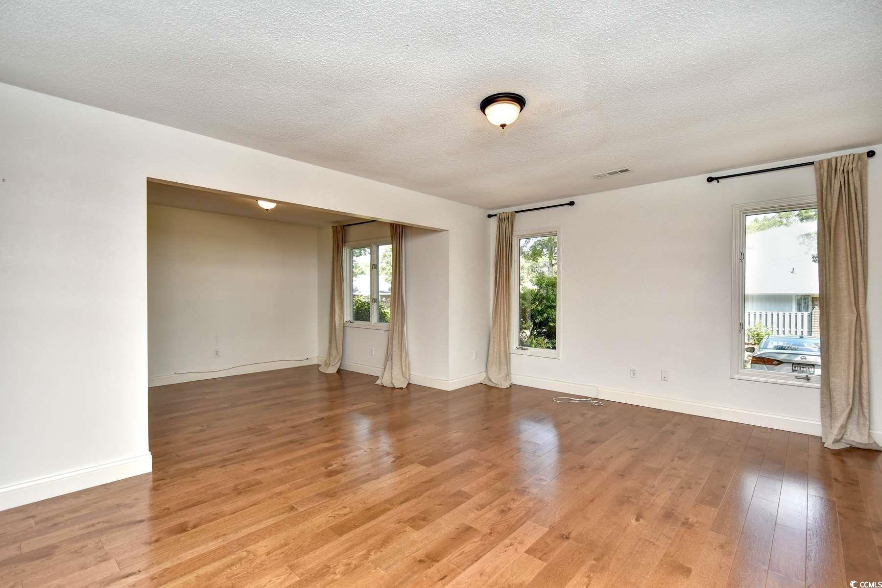 816 Kittiwake Lane Murrells Inlet, SC 29576 - Photo 6 of 25 Unfurnished room with light wood finished floors,