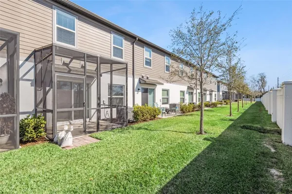 a view of a house with a yard and a garden