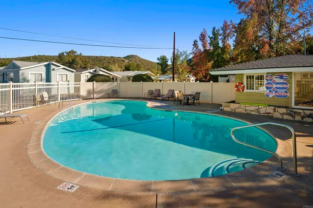 a view of a house with backyard