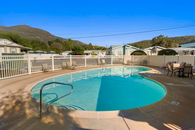 a view of a swimming pool with a patio