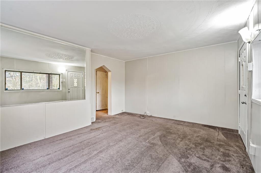 421 High Street McKeesport, PA 15132 - Photo 5 of 23 a view of an empty room with wooden floor and a window