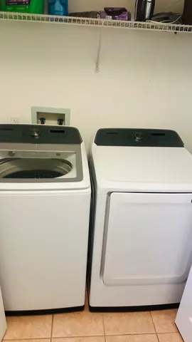 a utility room with dryer and washer