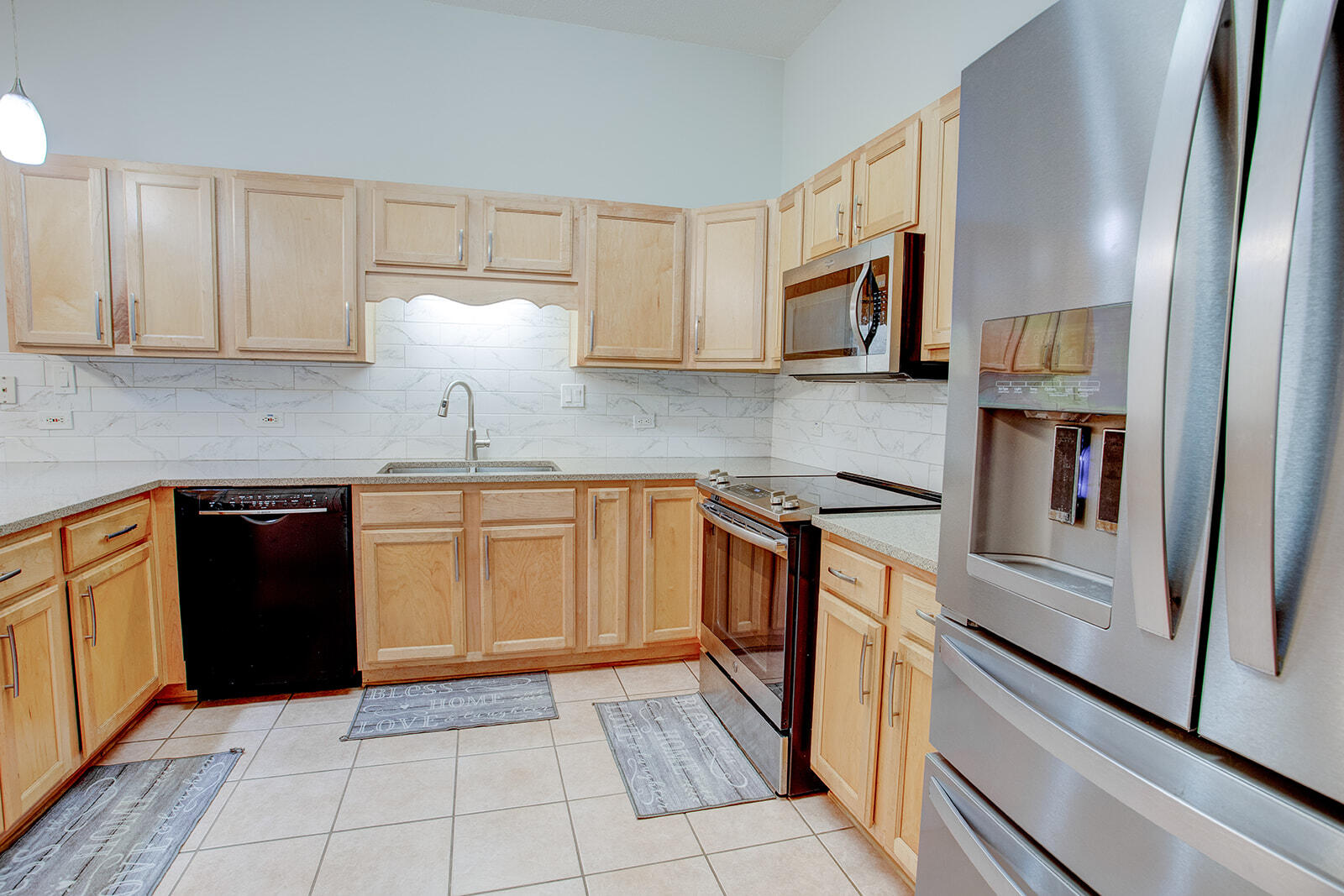 1956 Woodcrest Ridge Fort Walton Beach, FL 32547 - Photo 12 of 31 a kitchen with stainless steel appliances granite countertop a refrigerator and a stove top oven