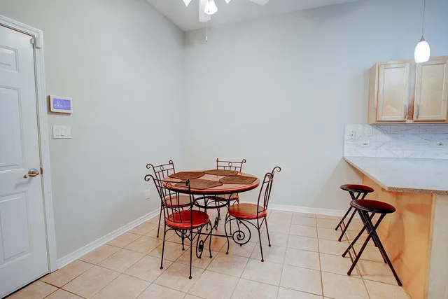 a view of a room with furniture and a potted plant