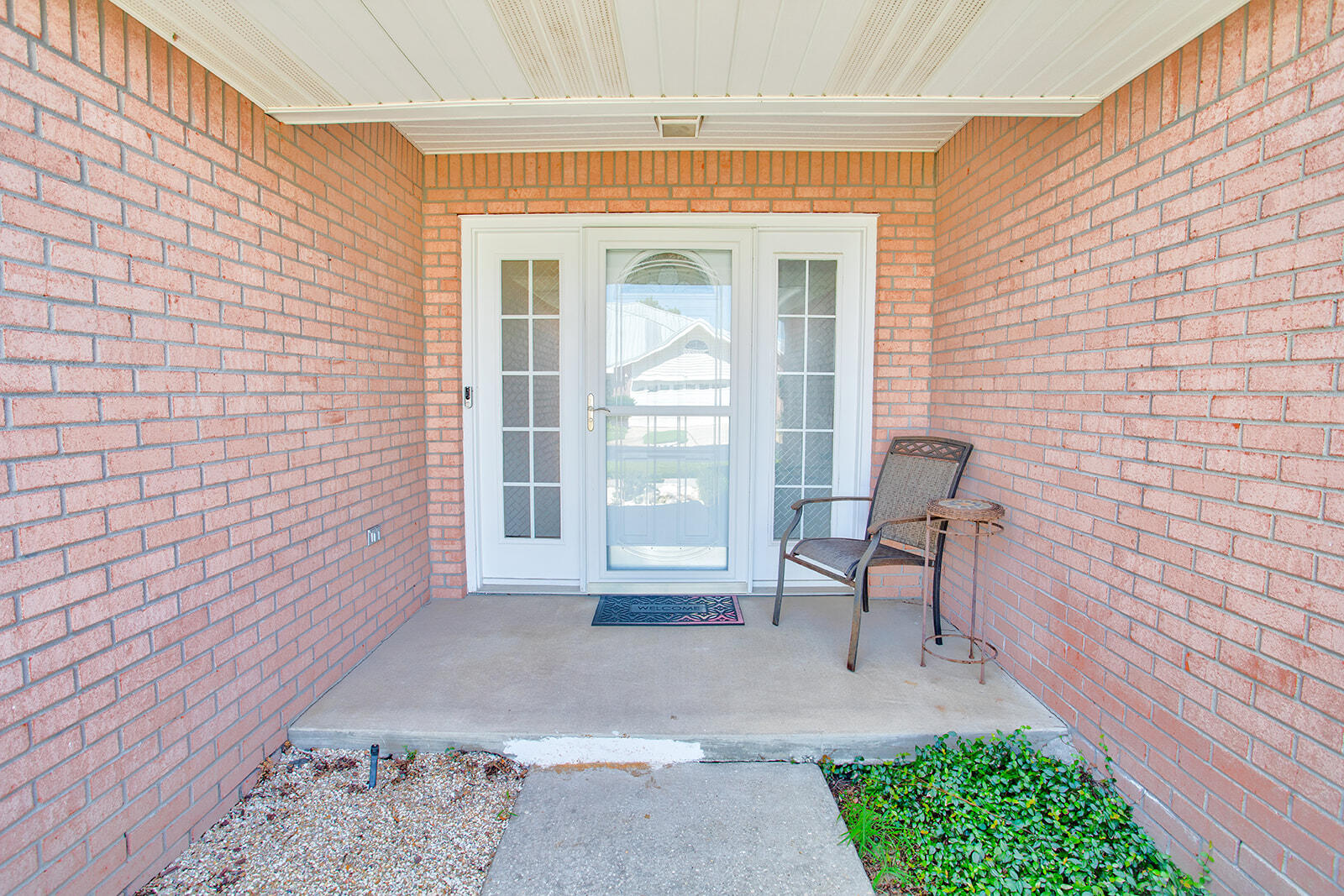 1956 Woodcrest Ridge Fort Walton Beach, FL 32547 - Photo 2 of 31 a view of a porch with a bench and a potted plant
