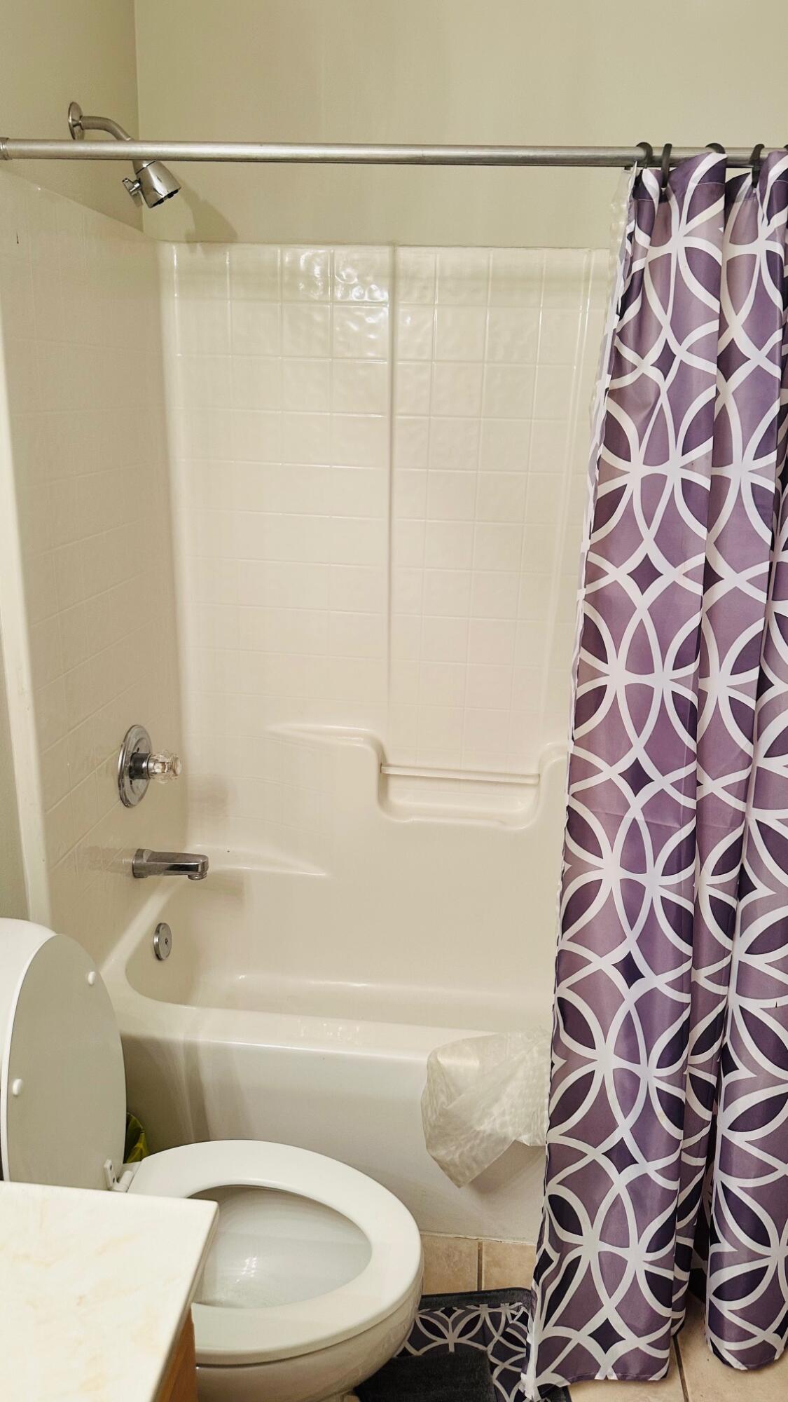 1956 Woodcrest Ridge Fort Walton Beach, FL 32547 - Photo 21 of 31 a bathroom with a bathtub and a shower
