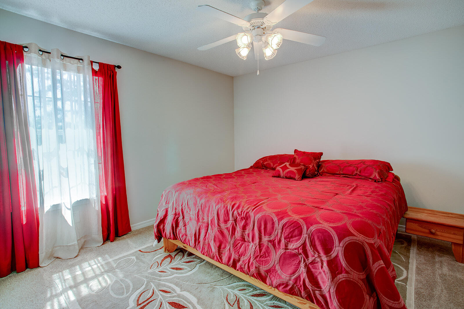 1956 Woodcrest Ridge Fort Walton Beach, FL 32547 - Photo 23 of 31 a bed sitting in a bedroom next to a window and a chandelier