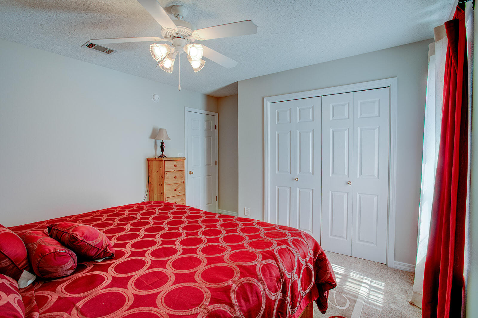 1956 Woodcrest Ridge Fort Walton Beach, FL 32547 - Photo 24 of 31 a bedroom with a bed and a lamp