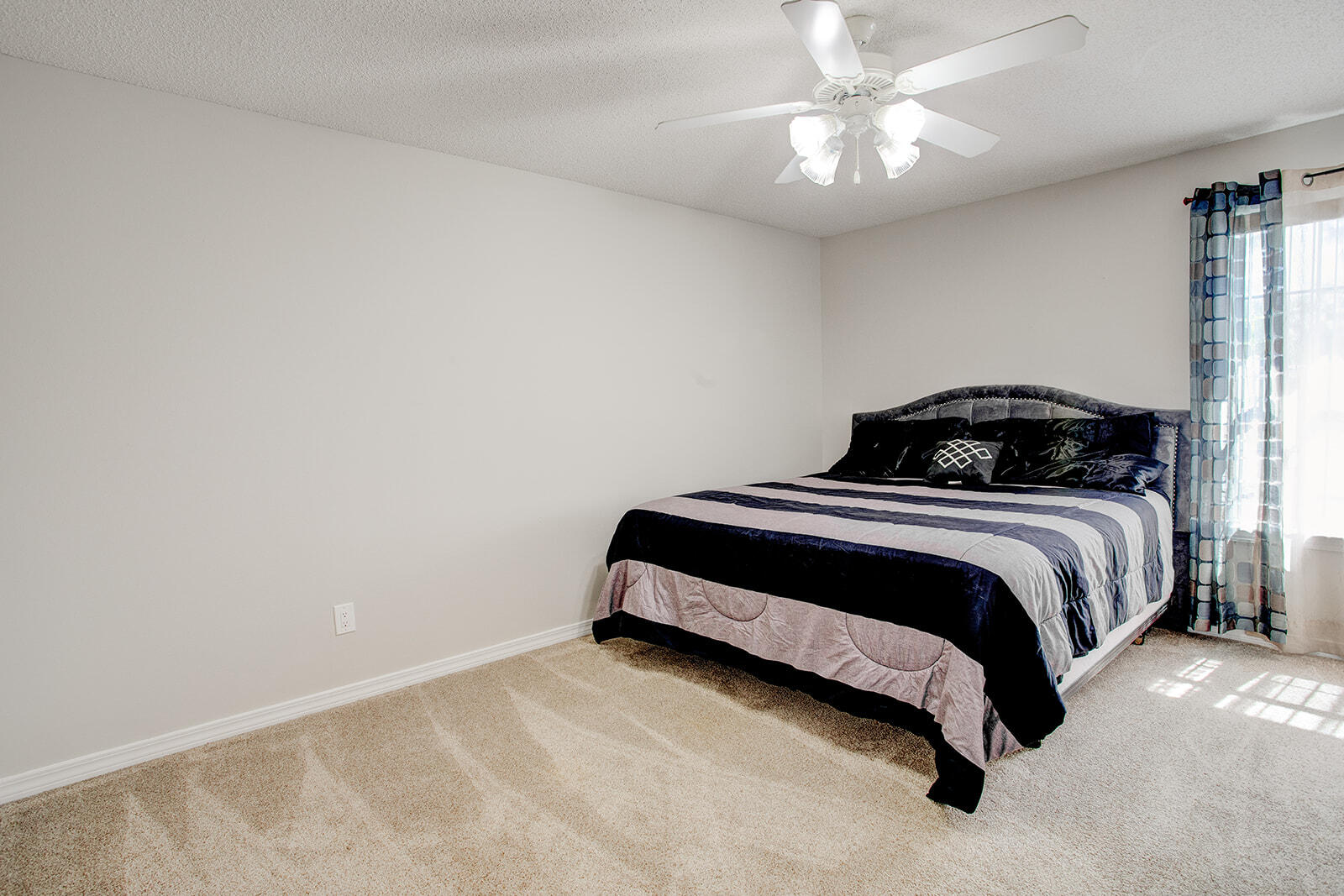 1956 Woodcrest Ridge Fort Walton Beach, FL 32547 - Photo 25 of 31 a bedroom with a bed and a chandelier