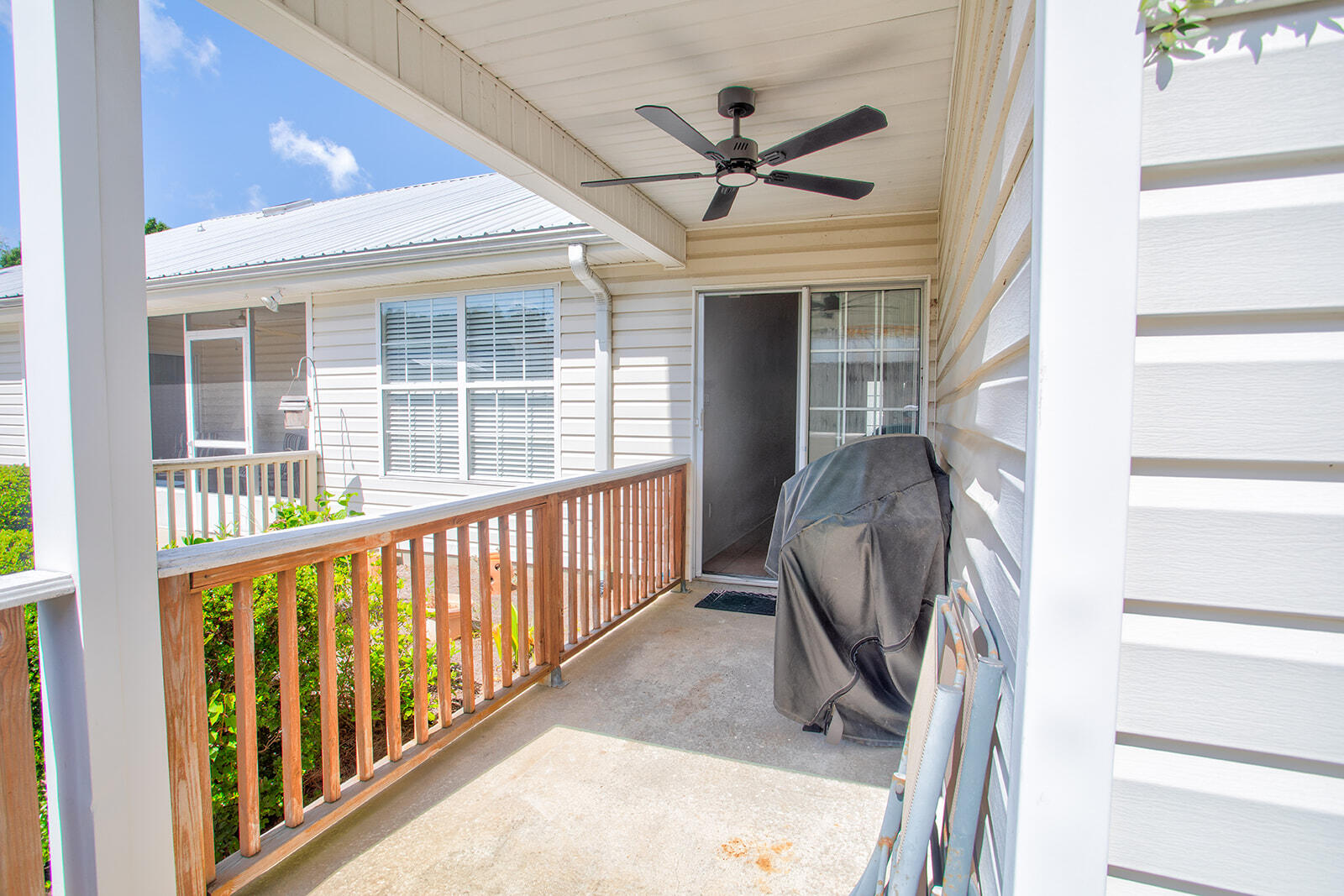 1956 Woodcrest Ridge Fort Walton Beach, FL 32547 - Photo 29 of 31 a view of a livingroom with a ceiling fan and wooden floor