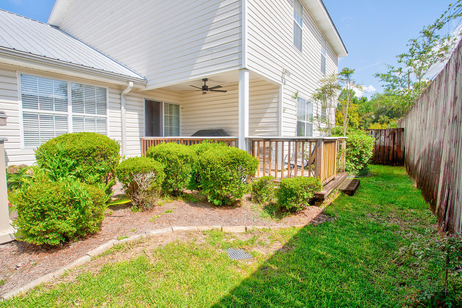 1956 Woodcrest Ridge Fort Walton Beach, FL 32547 - Photo 30 of 31 a view of a house with a backyard and a garden