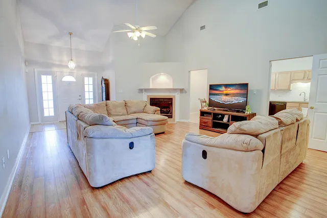 a living room with furniture and a fireplace