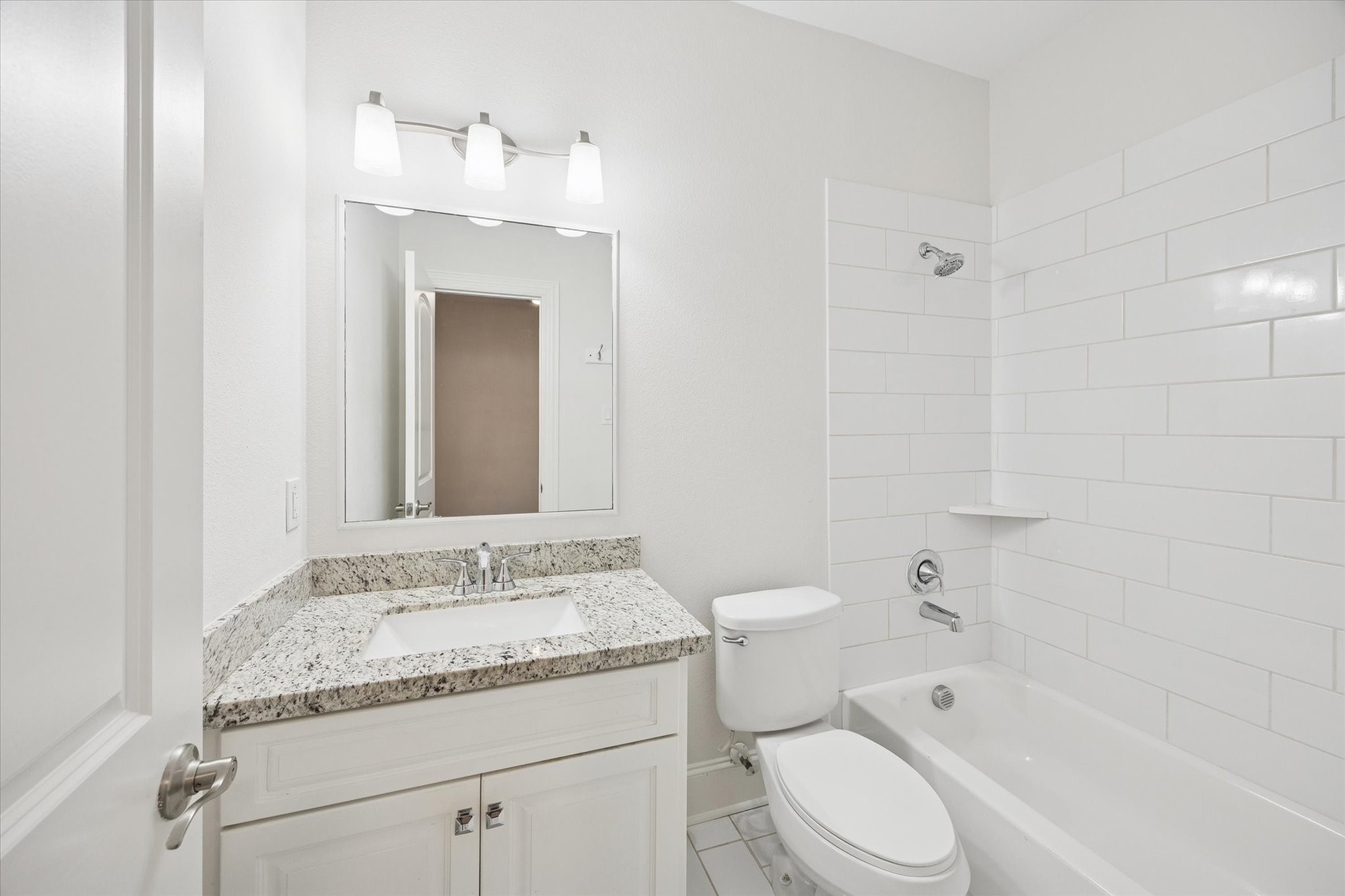 1630 West 24th Street Houston, TX 77008 - Photo 14 of 24 1st level bathroom. quartz countertops, subway tile