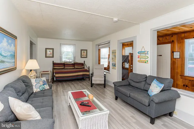 a bathroom with a sink a toilet and shower curtain