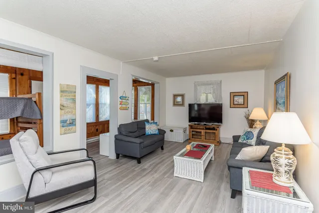 a bedroom with a bed and a dresser in it