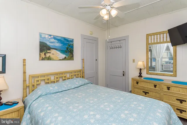 a kitchen with stainless steel appliances kitchen island granite countertop a sink a stove and a wooden floors