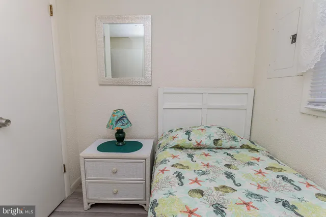 a white toilet sitting next to a shower curtain