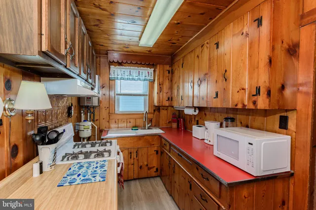 a view of a dining room with furniture and a window