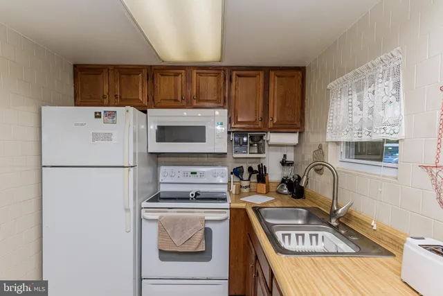 a dining room with furniture and a window