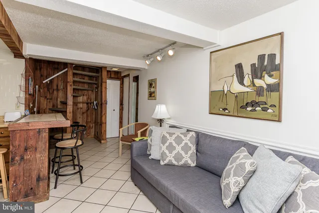 a bedroom with a bed and a table in it