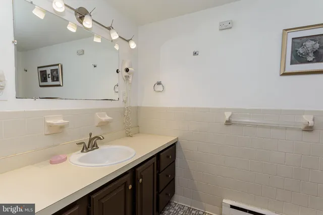 a bedroom with two beds and painted walls