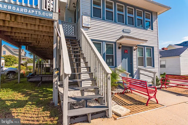 a bed room with a bed and a chair