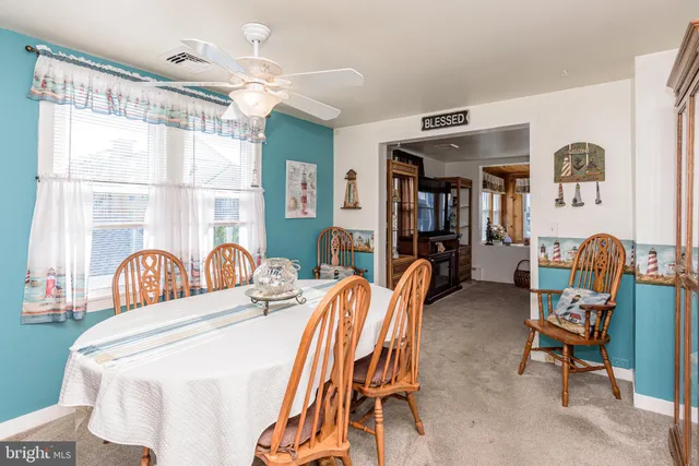 a kitchen with dining table and chairs