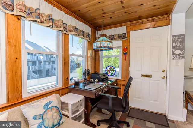 a bedroom with a bed and a dresser in it