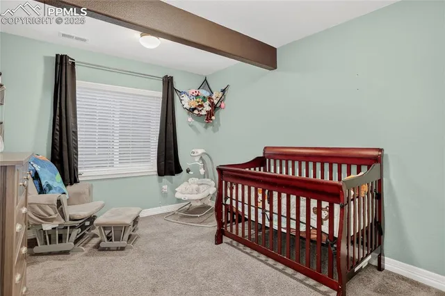 a bedroom with furniture and a window