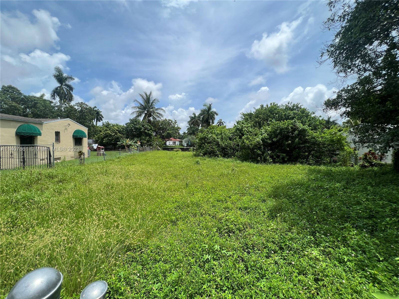 75 Northwest 85th Street Miami, FL 33150 - Photo 3 of 10 a view of a garden with a fountain