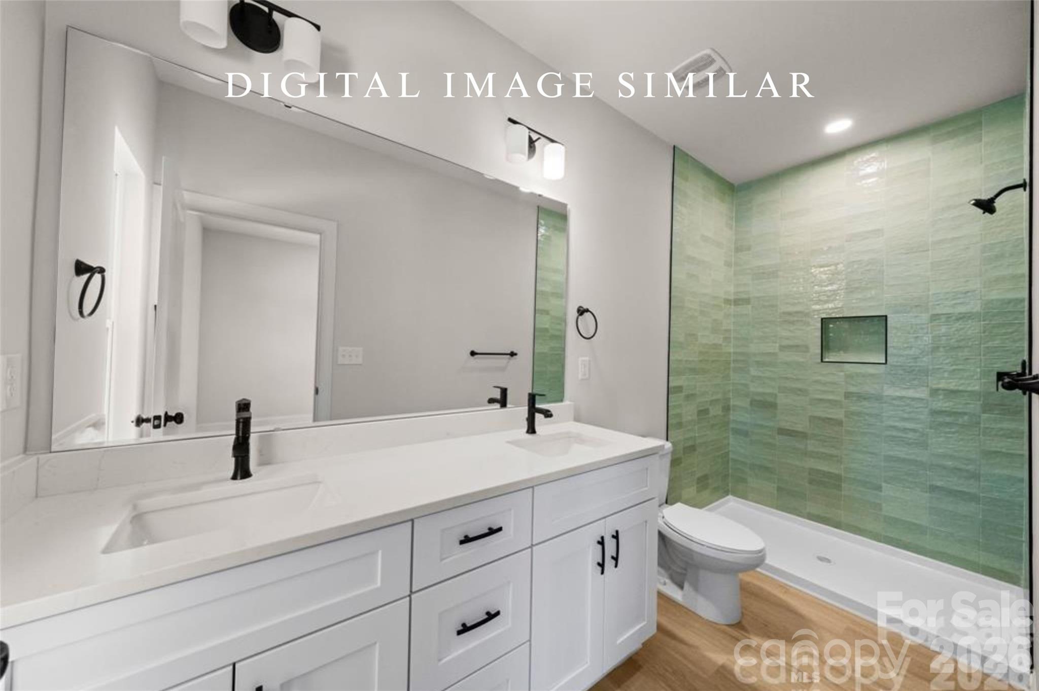 2928 Mulberry Church Road Charlotte, NC 28208 - Photo 31 of 43 a bathroom with a sink a toilet and shower