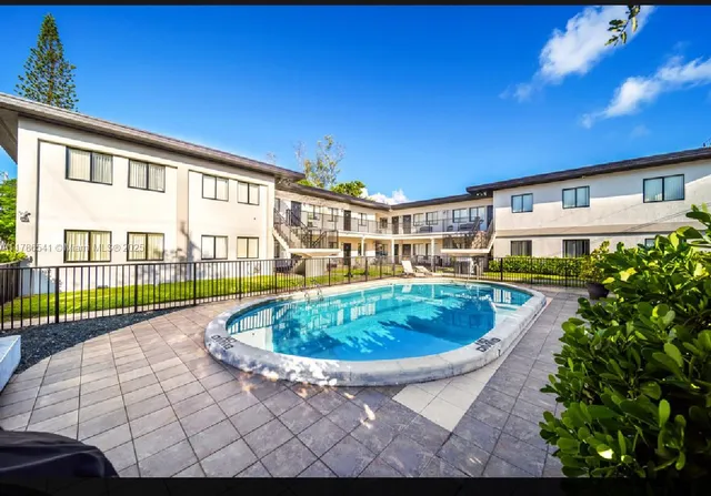 a view of a swimming pool with a patio