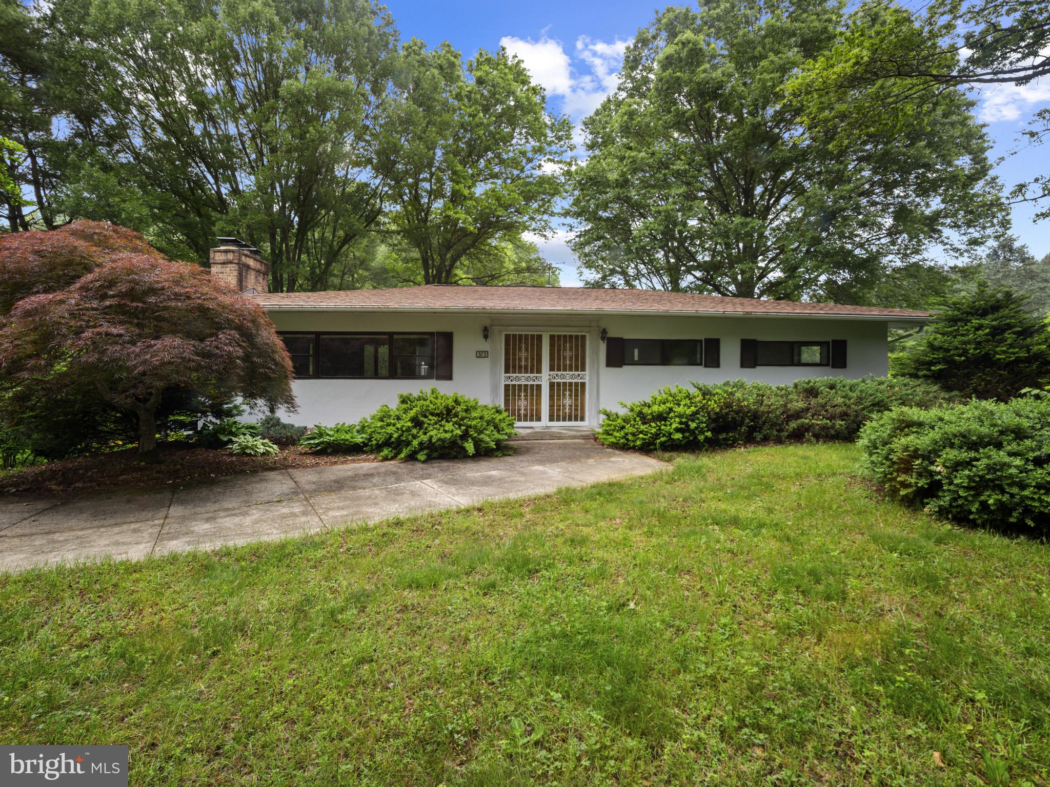 a house view with a garden space