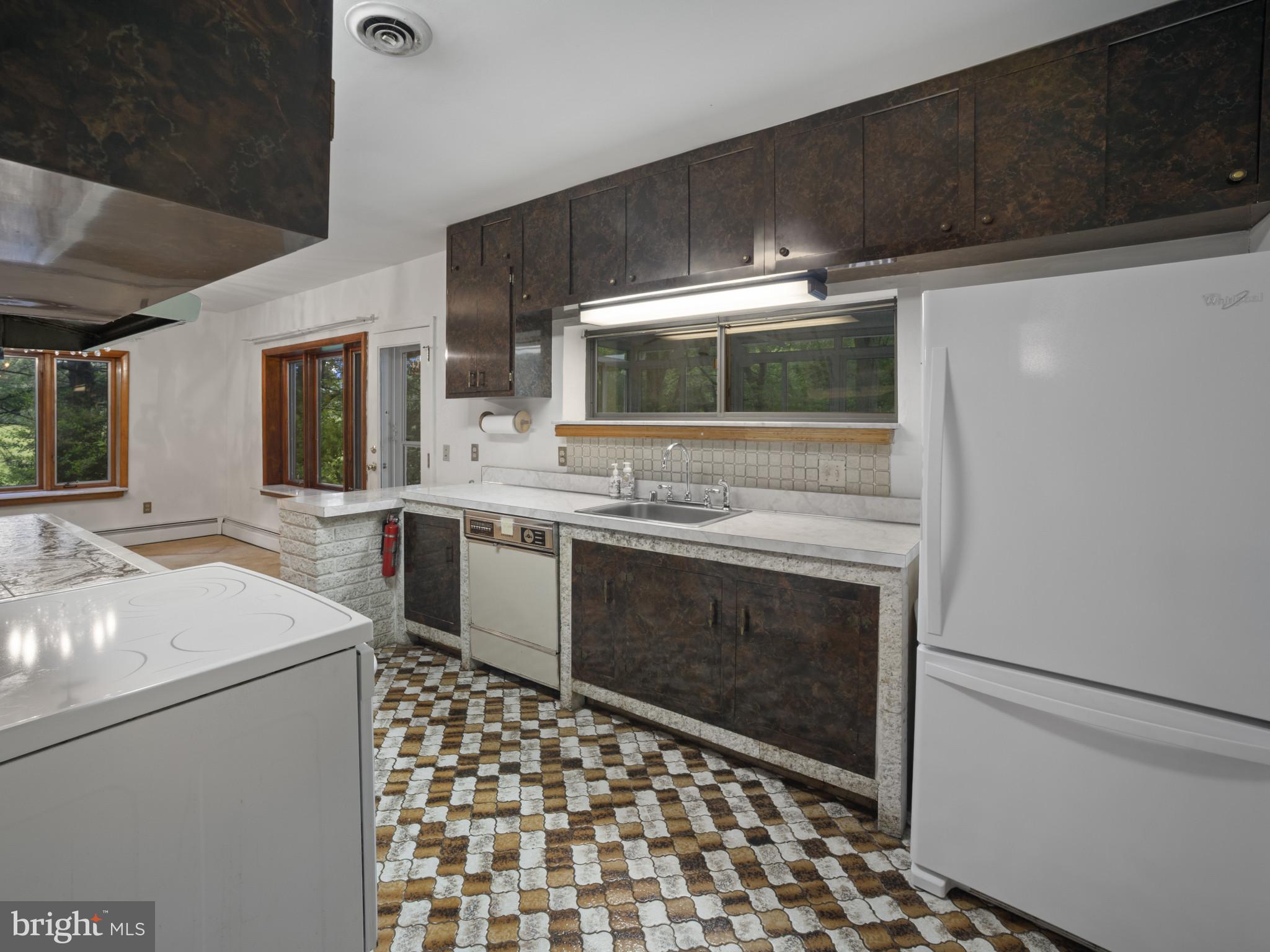 372 Sansbury Road Friendship, MD 20758 - Photo 12 of 33 a kitchen with a stove and a sink