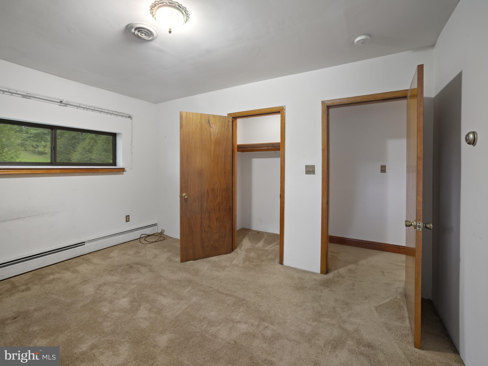 372 Sansbury Road Friendship, MD 20758 - Photo 18 of 33 an empty room with closet and windows