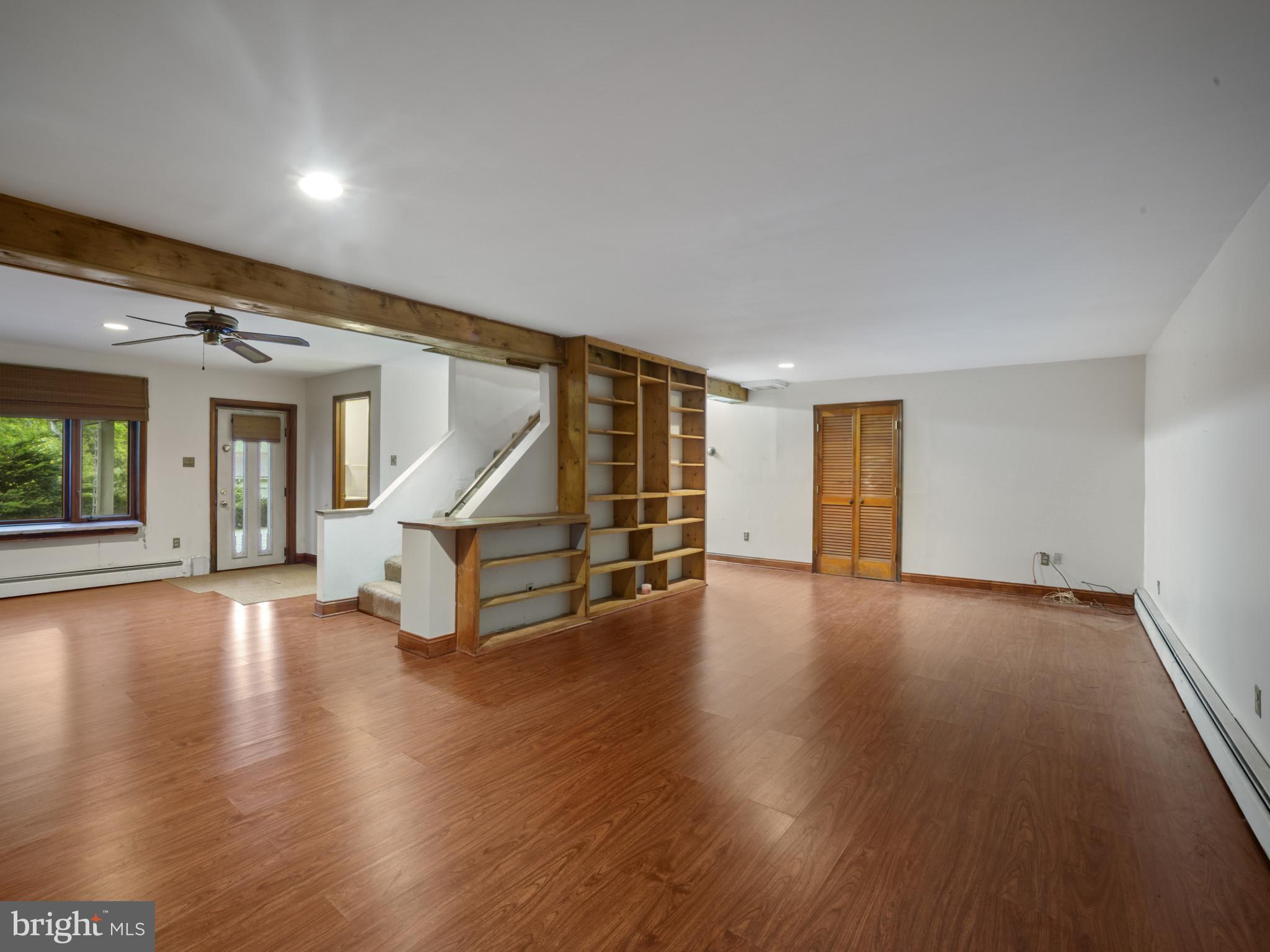 372 Sansbury Road Friendship, MD 20758 - Photo 2 of 33 a view of an empty room with wooden floor windows