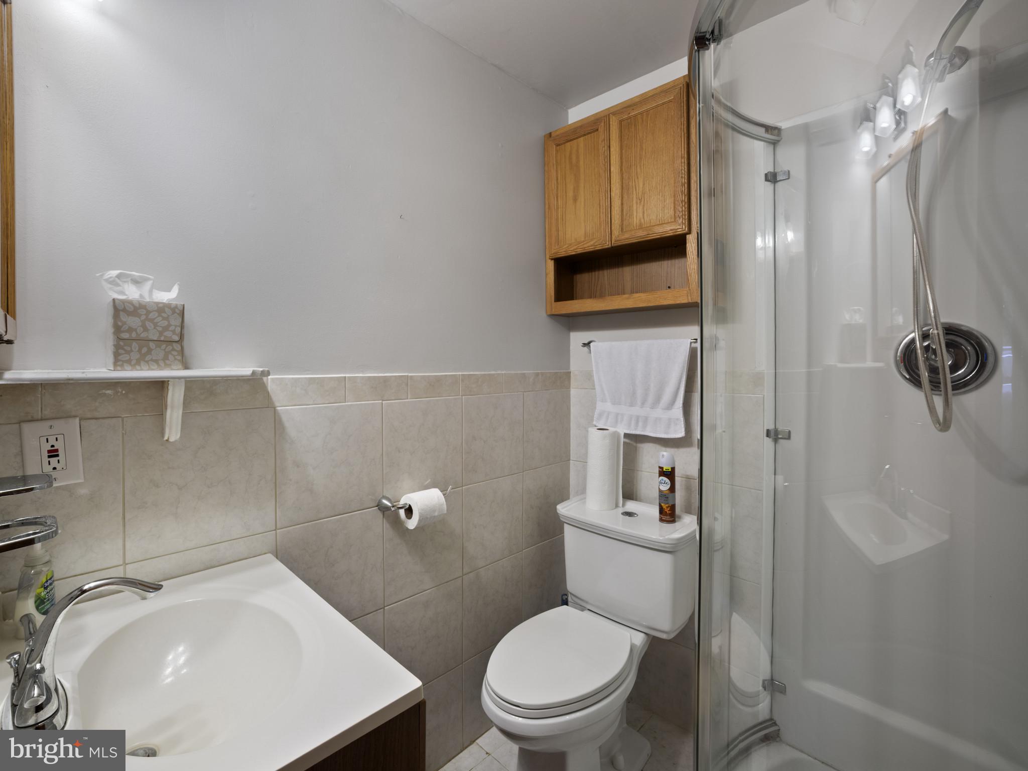 372 Sansbury Road Friendship, MD 20758 - Photo 27 of 33 a bathroom with a toilet a sink and mirror