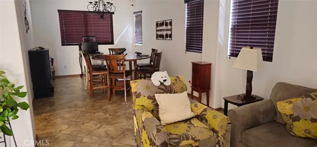 a view of a livingroom with furniture and window
