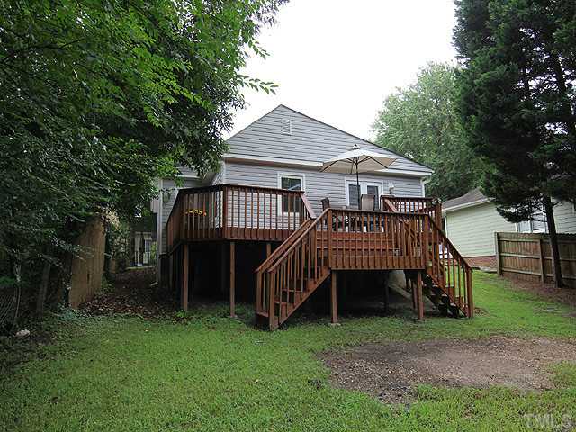 609 Latta Street Raleigh, NC 27607 - Photo 13 of 13 a view of a house with a yard and deck