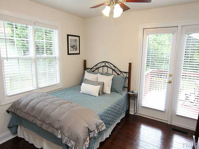 609 Latta Street Raleigh, NC 27607 - Photo 7 of 13 a bedroom with a bed and a window