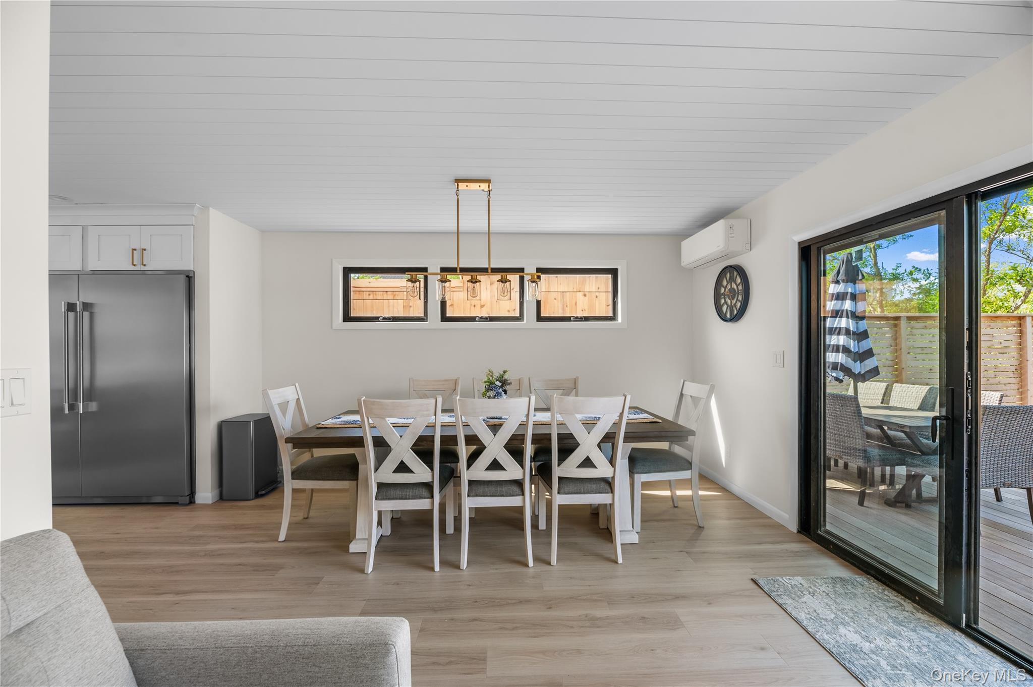 108 Ocean Road Ocean Beach, NY 11770 - Photo 9 of 23 Dining room with light wood-style flooring and an AC wall unit